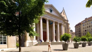 St Pierre Cathedral in Geneva with neoclassical facade and tree-lined square